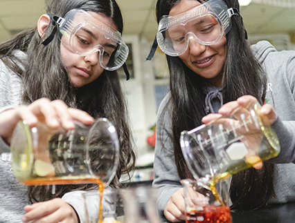 Two students doing science experiment