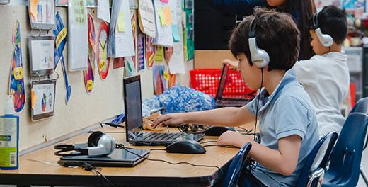 Boy working on laptop