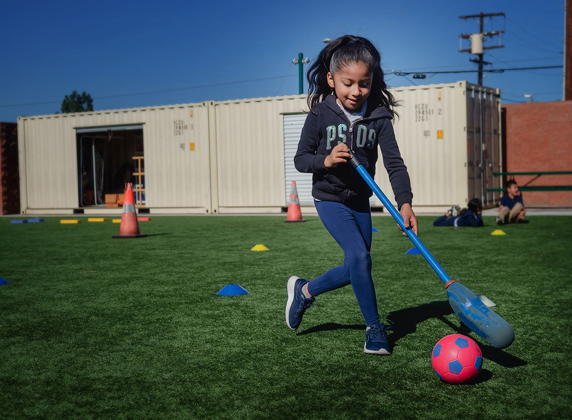 girl playing soccer